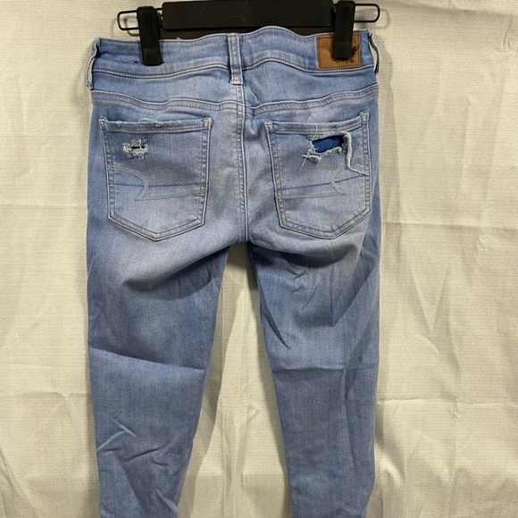 American Eagle super stretch super low jean jeggings rips ankle fringe size 4 - Picture 3 of 5
